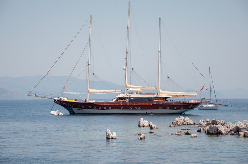 Elegant yacht cruising on calm waters in Marmaris with scenic views.